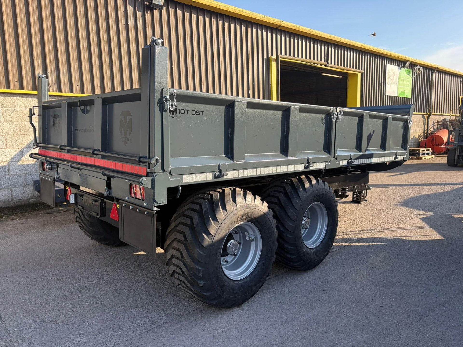 MT Plant 10T DST dropside trailer, rear three-quarter view outside the workshop